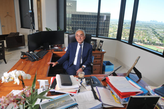 Henry Manoucheri, CEO, Universe Holdings, at his desk.