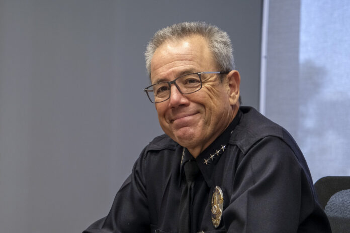 LAPD Chief Michel R. Moore and Commissioner Steve Soboroff meet with LABJ Publisher Josh Schimmels and Editor Charles Crumpley in LABJ office in Los Angeles, April 6, 2022. (Photo by Ringo Chiu)