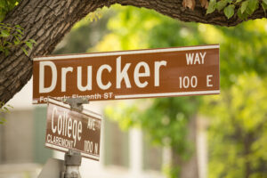 Drucker and College street sign