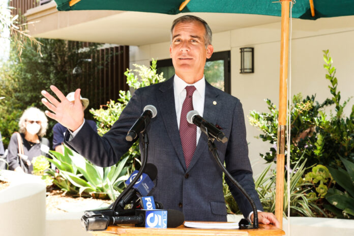 Mayor Eric Garcetti speaks at the opening Missouri Place. (Photo by FilmMagic)