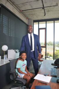 Malcolm Johnson, CEO, Langdon Park Capital, with his son, Justice (8 years-old).