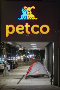 A homeless tent sits on the sidewalk in front of of a PETCO store near Beverly BLVD and La Jolla Ave in Los Angeles, Aug. 17, 2022. (Photo by Ringo Chiu)