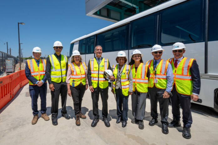 Officials celebrate the LAX People Mover milestones.