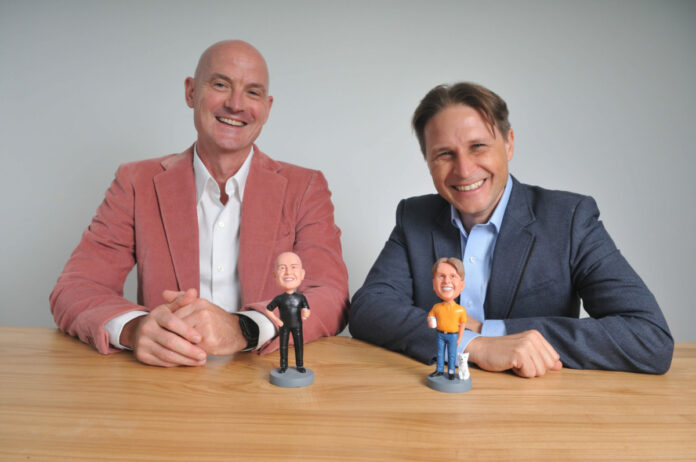 David Cavanaugh (left) and Stephane Budel with their bobblehead likeness in the DeciBio headquarters.