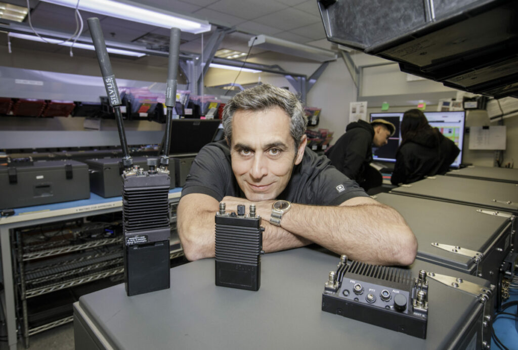 Babak Daneshrad, CEO of Silvus Technologies shows off three of their products, the SC 4200, the SL 4200, a wearable unit, and a car mount SC 4400 radio in his offices in Westwood, CA. January, 2023. Photo by David Sprague
