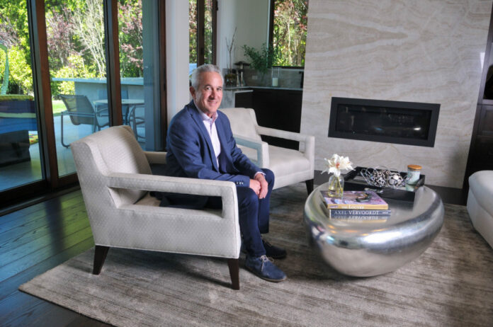 Mark Weinstein of MJW Investments poses at his home office in Santa Monica.