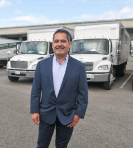 Carlos Herrera, CEO and Founder, with his fleet of trucks at IRS Demo HQ in South Gate.